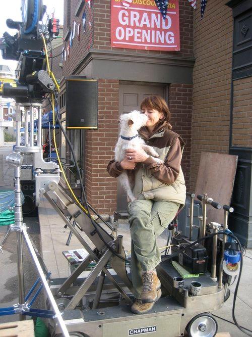 Mathilde kissing a dog from Hotel for Dogs